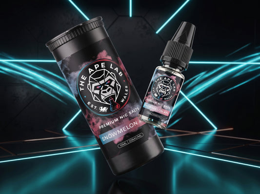 A bottle of e-liquid and its matching cylindrical packaging container from The Ape Lab, featuring a black and white design with pink and blue accents, labeled 'Snowmelon'. The products are set against a dark background with glowing cyan geometric lines.